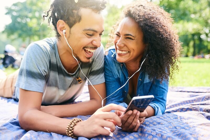 Woman listening to sumizeit book summaries on ios app